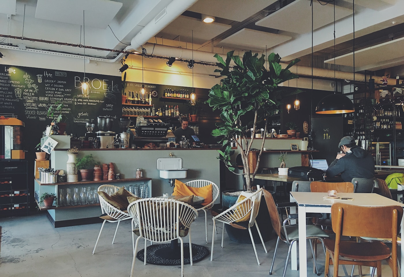 Interior of a Loyang coffee shop with kopi cups on formica